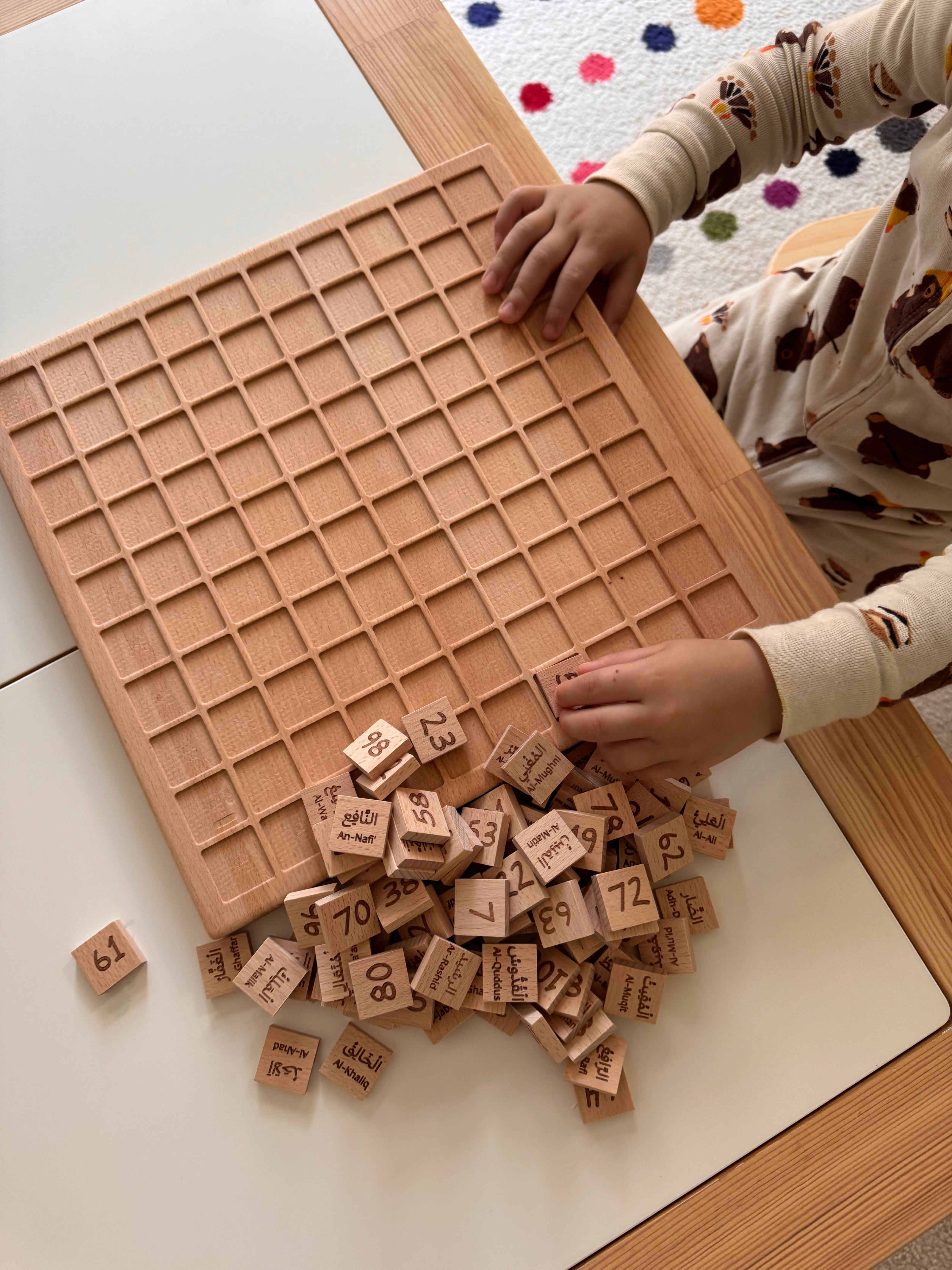 montessori board teaching muslim kids the 99 names of Allah and arabic numbers